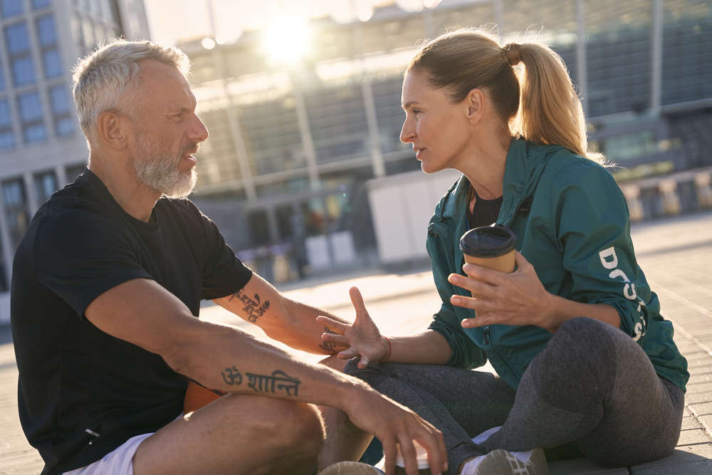 Portrait,Of,Sportive,Mature,Couple,Communicating,With,Each,Other,While